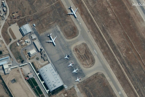 Satellite images from Maxar Technologies show six planes on September 3 at the Mazar-i-Sharif airport in northern Afghanistan, where there are reports several hundred people have been prevented from leaving the country