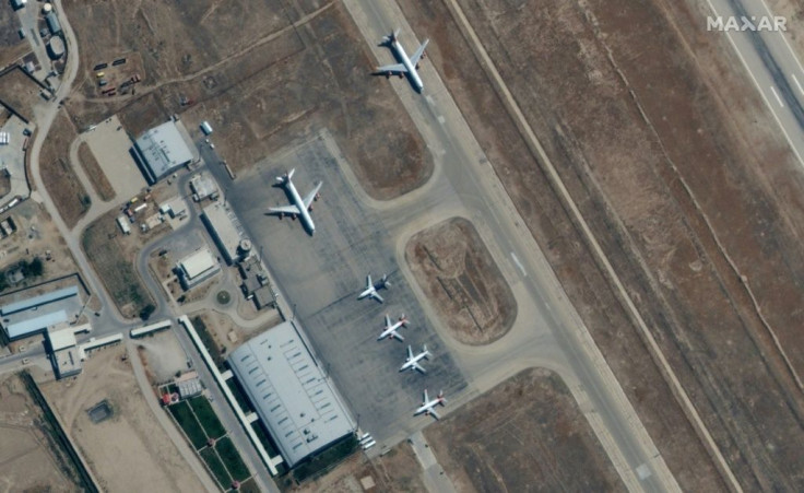 Satellite images from Maxar Technologies show six planes on September 3 at the Mazar-i-Sharif airport in northern Afghanistan, where there are reports several hundred people have been prevented from leaving the country