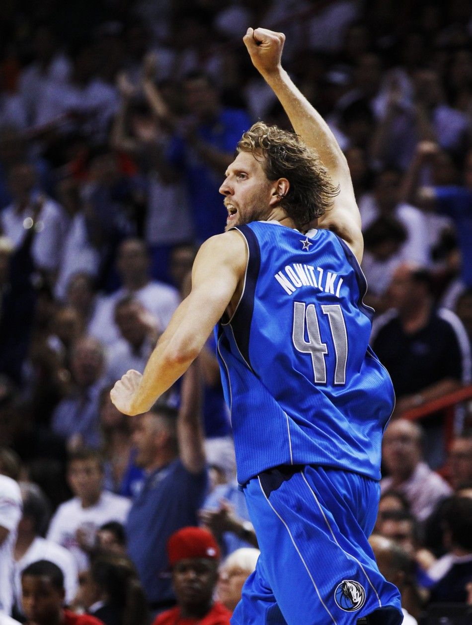 Mavericks039 Nowitzki celebrates after making a basket against the Heat during Game 6 of the NBA Finals basketball series in Miami