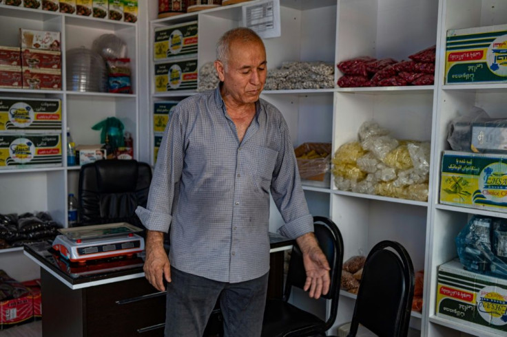 Convenience store owner Habib Uzbek, 69, received Turkish citizenship in 1993 but says he still feels pressure from being an Afghan
