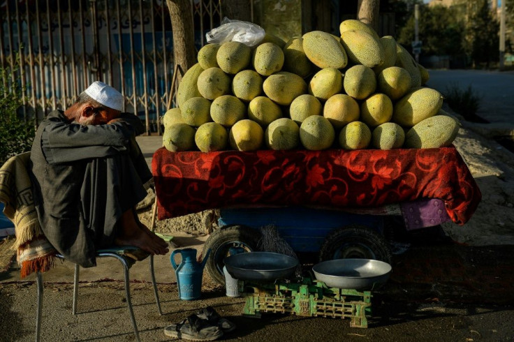 An Afghan fruit vendor waits for customers on a street in Kabul Tuesday