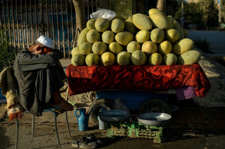 An Afghan fruit vendor waits for customers on a street in Kabul Tuesday