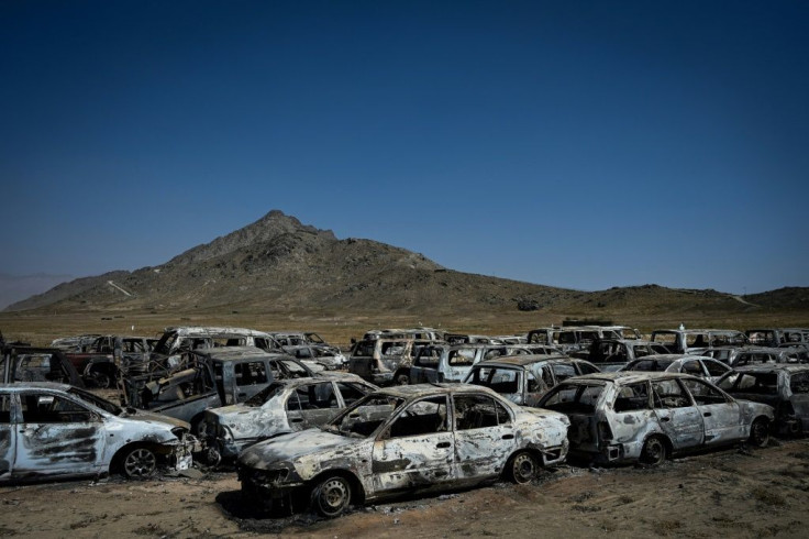 The parking lot is packed with the incinerated wrecks of scores of vehicles