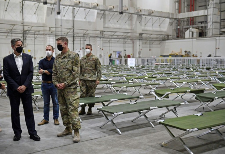 US Secretary of State Antony Blinken tours a processing centre for Afghan refugees at al-Udeid Air Base in the Qatari capital Doha