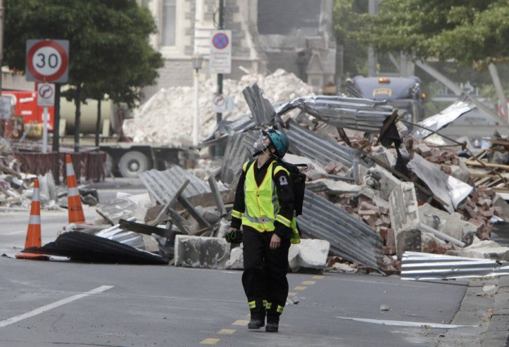 A rescue worker walks through the rubble in central Christchurch 02/03/2011