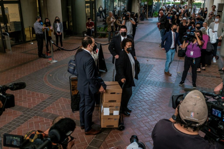 Lawyers arrive for the first day of the trial in San Jose, California