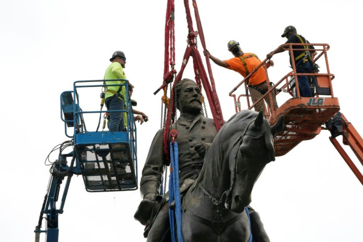 Workers preparing to remove a statue of Confederate General Robert E. Lee in Richmond, Virginia