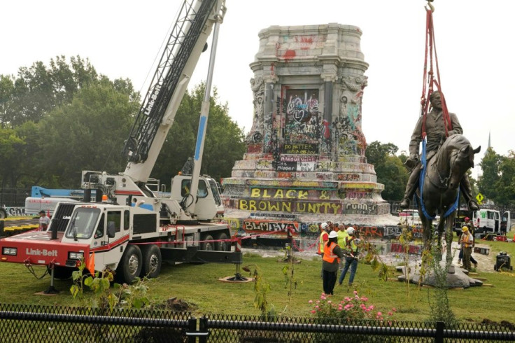 The statue of Confederate General Robert E. Lee being removed in Richmond, Virginia