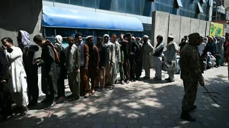 Huge queues form daily outside Kabul banks where customers are limited to withdrawals of $200 a day