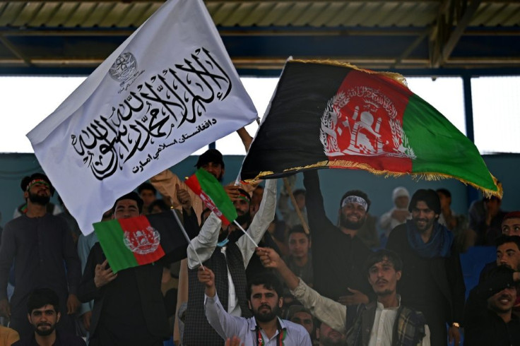 Spectators wave Afghanistan and Taliban flags at a Twenty20 cricket trial match in Kabul last week. Australia said Thursday they will call off a historic first ever Test against Afghanistan unless the Taliban allows women to play sport
