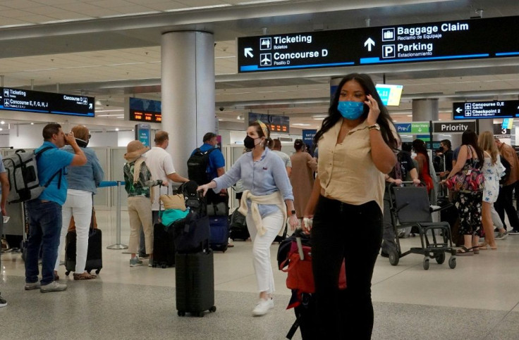 Leading US carriers cut their third-quarter forecasts, citing the drag from the latest Covid-19 wave