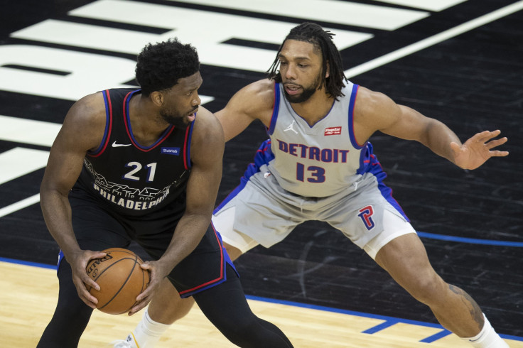 Joel Embiid #21 of the Philadelphia 76ers controls the ball against Jahlil Okafor #13 of the Detroit Pistons 