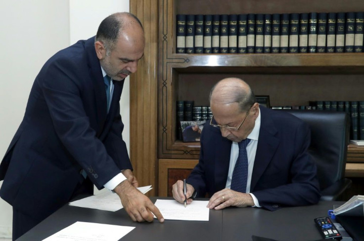 President Michel Aoun signs a decree for the formation of a new Lebanese government after meeting prime minister-designate Najib Mikati