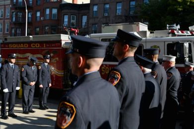 Firefighters in Brooklyn, New York observe a moment of silence on September 11, 2021 to mark those lost in the terror attacks 20 years earlier