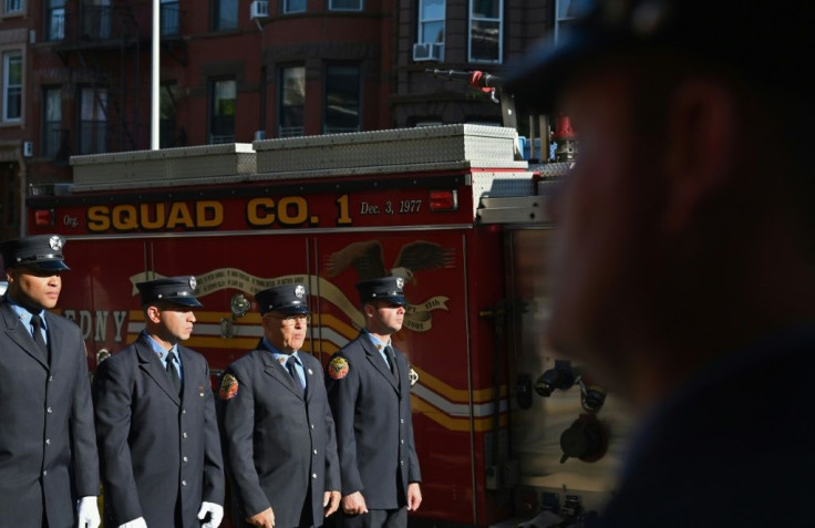 Brooklyn firefighters line up outside their station for a memorial ceremony on September 11, 2021