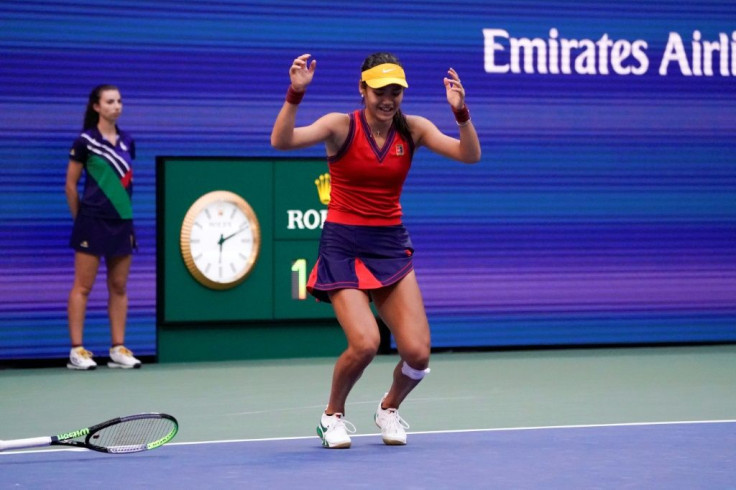 Britain's Emma Raducanu drops her racket as she reacts to winning the US Open women's final on Saturday