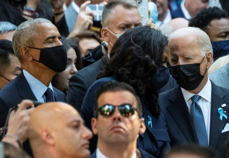 US President Joe Biden (right), with former President Barack Obama (left) and former First Lady Michelle Obama at the ceremony at the National 9/11 Memorial