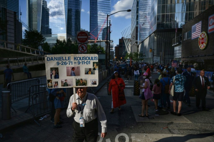 A man walks with the name of a loved one lost in the 9/11 attacks on the World Trade Center outside the 9/11 Museum and Memorial in New York