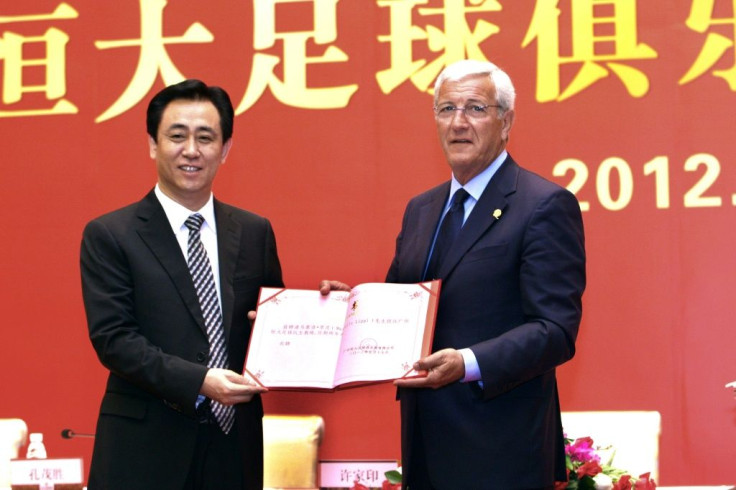 Guangzhou Evergrande's Xu Jiayin (L) at one point was the richest person in China