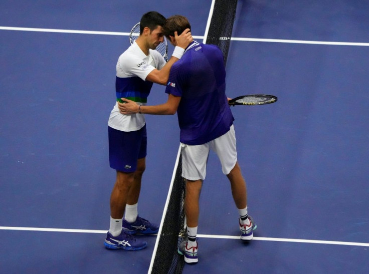Respect: Russia's Daniil Medvedev and Serb Novak Djokovic embrace at the net after Medvedev's victory in the 2021 US Open final