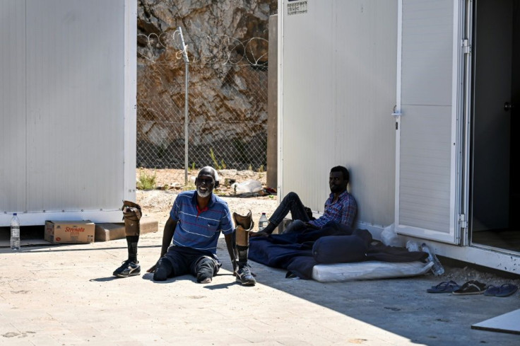 After being searched, the incoming migrants are photographed, fingerprinted and rigorously interviewed