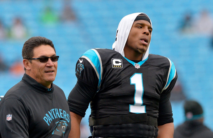 Head coach Ron Rivera and Cam Newton #1 of the Carolina Panthers