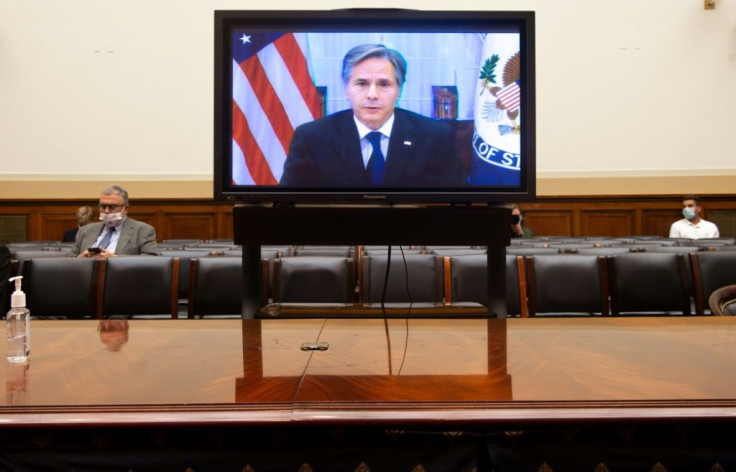 US Secretary of State Antony Blinken appears on a television screen as he testifies virtually on the US withdrawal from Afghanistan during a House Foreign Affairs Committee hearing