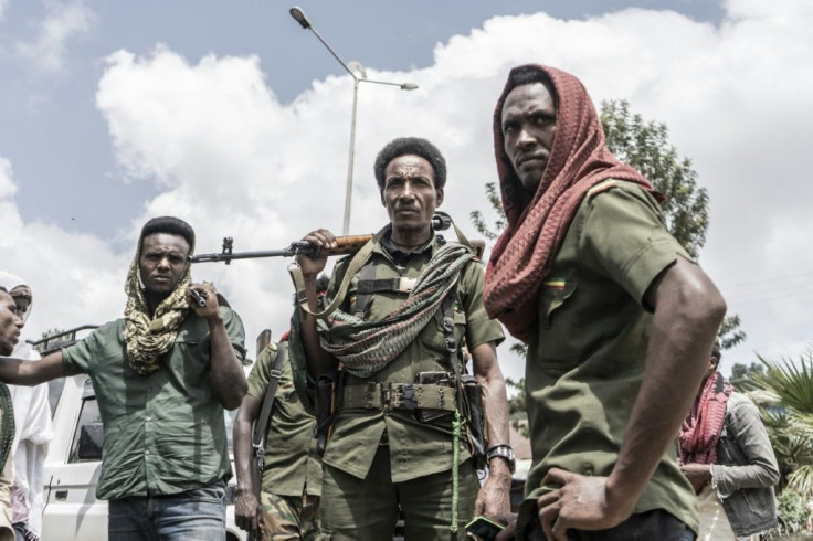 Amhara militiamen stand guard in the Ethiopian town of Dabat
