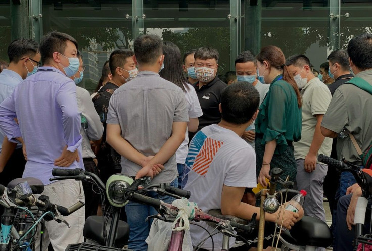 Angry investors returned to Evergrande's Shenzhen headquarters to demand their money back, and were met with a heavy police presence