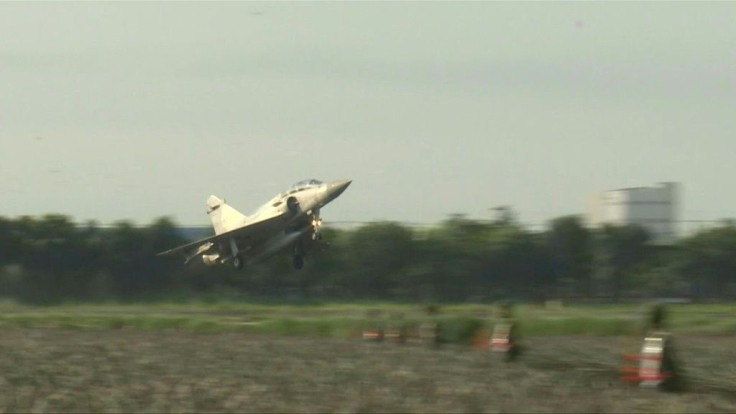 Taiwanese airforce fighter jets and an E-2K Early Warning Aircraft land and take off on a motorway in an exercise simulating a mock attack by enemies destroying their airbase. The military exercise is part of Taiwan's annual live-fire war games to prepare