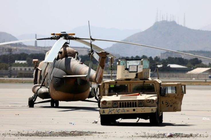 Dozens of damaged planes and vehicles were cordoned off by Taliban barricades