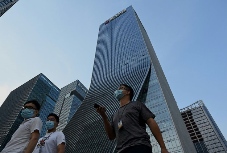 People protested outside the Evergrande headquarters in Shenzhen, China as the property giant said it is facing "unprecedented difficulties"