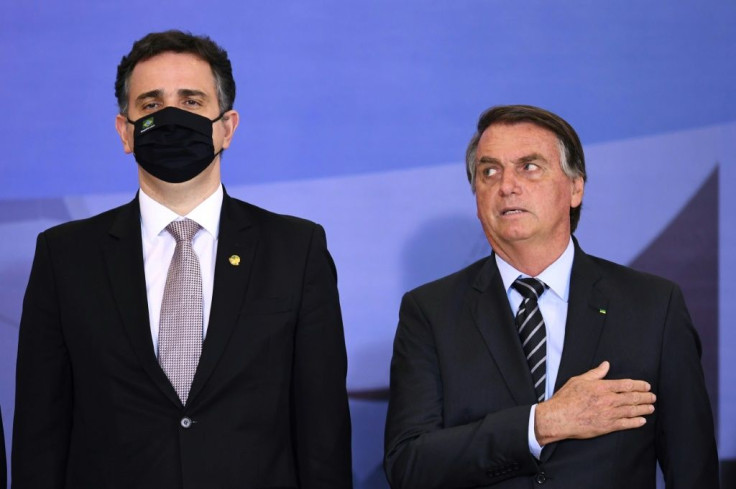 Brazilian President Jair Bolsonaro (R) has launched fiery attacks on the Supreme Court and the country's election system, prompting Human Rights Watch to warn that he is "threatening democratic rule"