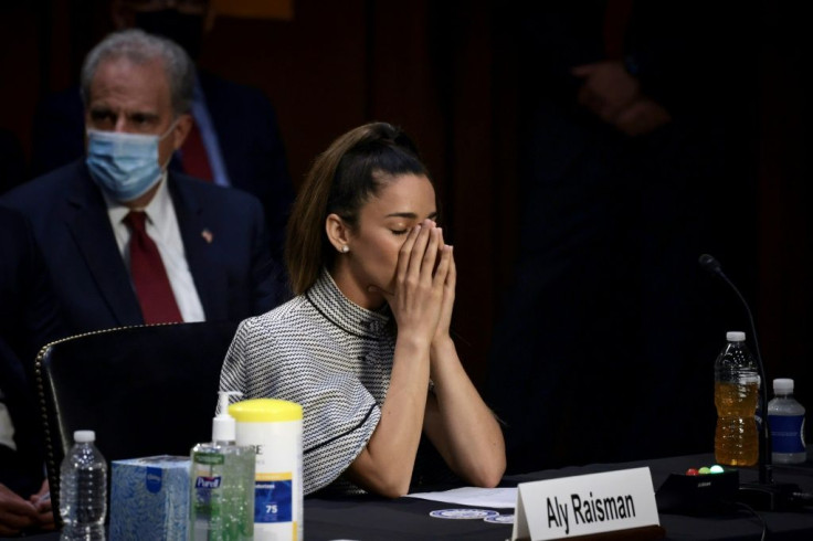 Olympic champion Aly Raisman closes her eyes as she listens to testmony at a Senate Judiciary Committee hearing into sexual abuse by former team doctor Larry Nassar
