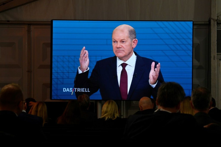 The SPD's leading candidate, Finance Minister Olaf Scholz, is in pole position to take Merkel's crown