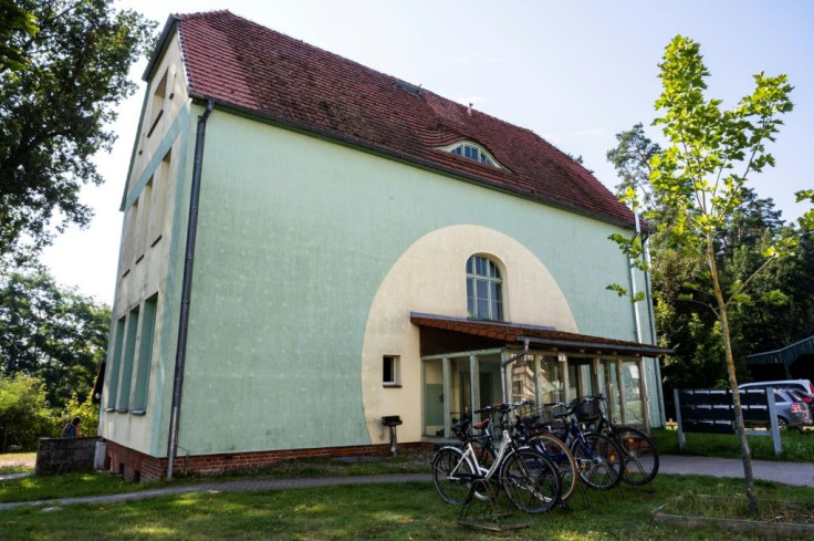 The house in which Merkel's family lived in Templin is on the edge of a wood, with a home for the disabled that they ran next door