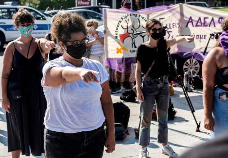 Around 50 women activists rallied in support of the young Briton, holding banners that said "I believe her" and "Sister, we believed you from the start"