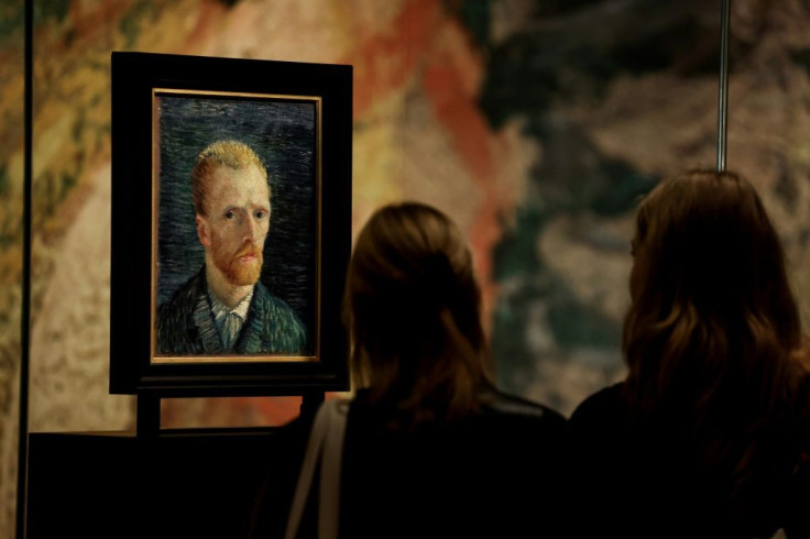 Visitors look at a selfportrait of Vincent Van Gogh at the Van Gogh Museum in Amsterdam