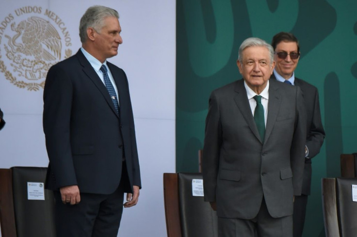Cuban President Miguel Diaz-Canel (L) and Mexican President Andres Manuel Lopez Obrador attend a ceremony marking Mexico's independence, in Mexico City on September 16, 2021