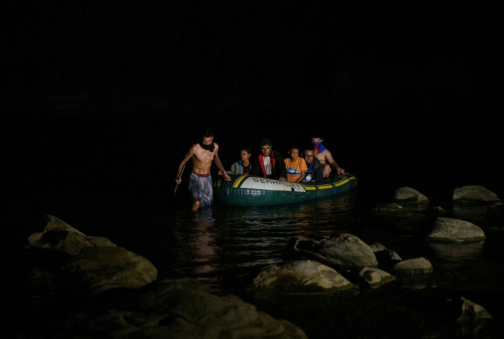 Migrants arrive in the United States near Roma, Texas after crossing the Rio Grande from Mexico.