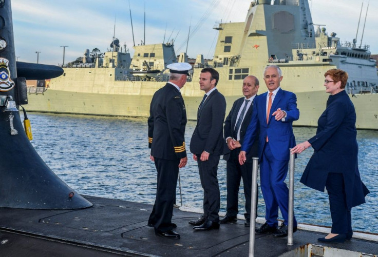 French President Emmanuel Macron and Australia's then prime minister Malcolm Turnbull stand on the deck of HMAS Waller submarine in May 2018 in Sydney as Paris fulfilled a major new contract that has since been scrapped