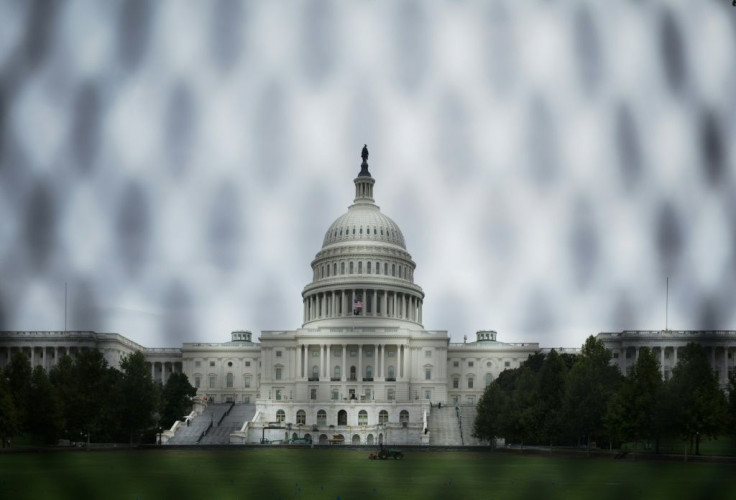 The US Capitol is seen through a temporary security fence in Washington, DC on September 16, 2021. Security measures are heightened in Washington, DC, in preparation for a September 18 demonstration to protest against the prosecution of suspects in the Ja