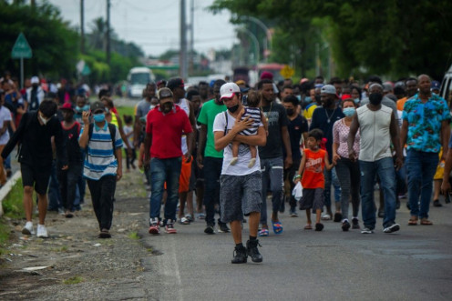 Haitian and Central American migrants march to the Siglo XXI Migratory Station in Tapachula, Chiapas, Mexico, aiming to travel to the United States.