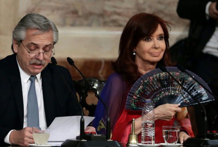 In this file photo taken in March 2020, Argentine President Alberto Fernandez (L) delivers a speech, next to Vice President Cristina Fernandez de Kirchner,