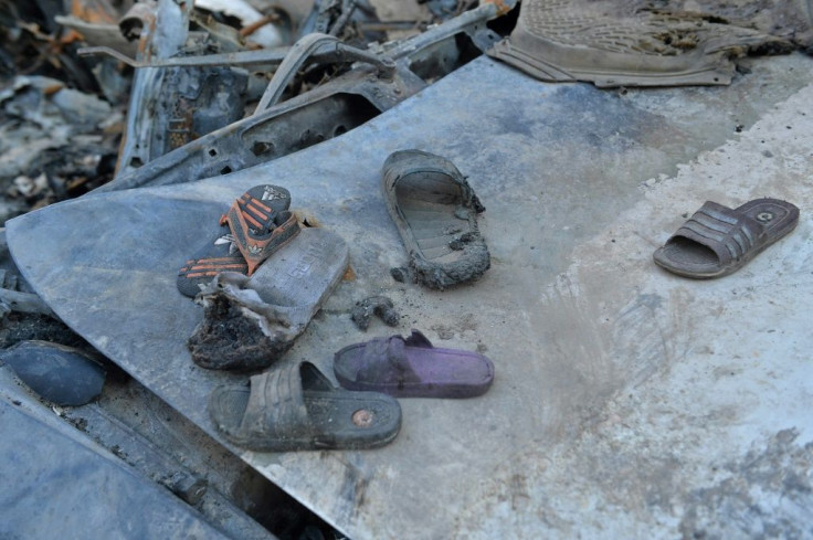 Burnt shoes are pictured amid the debris of Ezmarai Ahmadi's house, damaged in the US drone strike