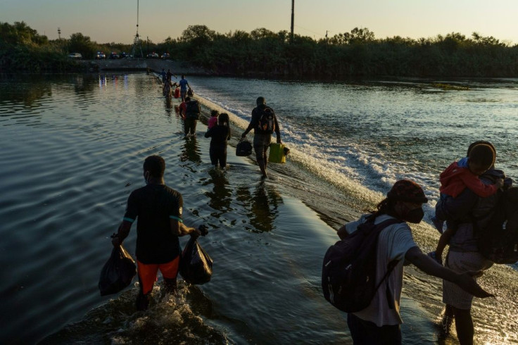 Haitian migrants cross the Rio Grande near the Del Rio-AcunÌa Port of Entry in Ciudad Acuña, Mexico