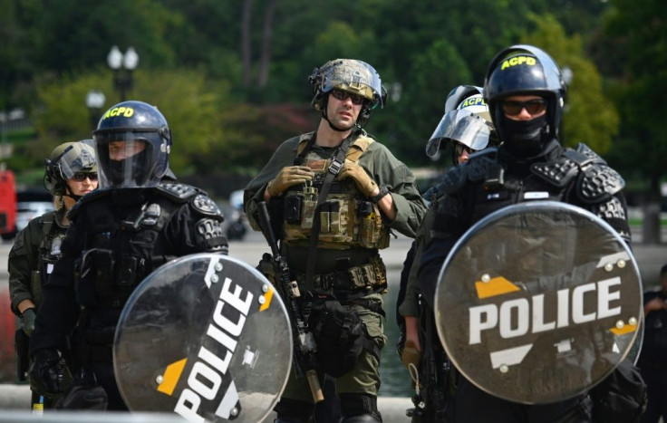 Police donned riot gear and carried shields for the rally in Washington