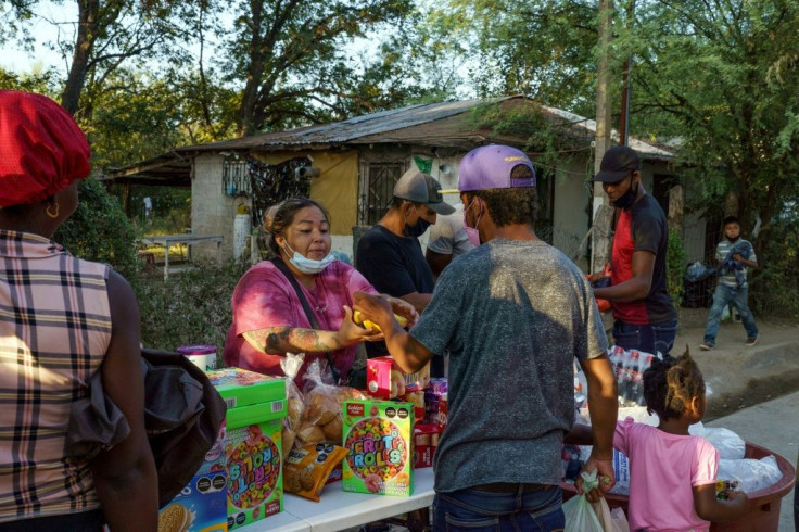 Haitian migrants buy food and supplies in Ciudad Acuna, Mexico September 18, 2021, crossing back and forth across the border to purchase provisions