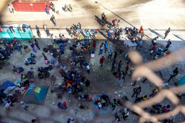 Migrants, mostly from Haiti, gather at a makeshift encampment under the International Bridge in Del Rio, Texas on the border with Mexico