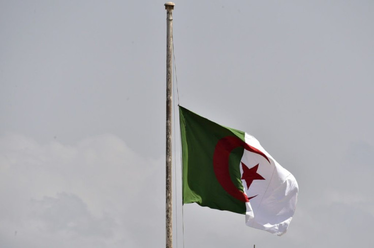 The Algerian national flag flies at half mast in the capital Algiers on September 18, 2021, before the funeral of former president Abdelaziz Bouteflika